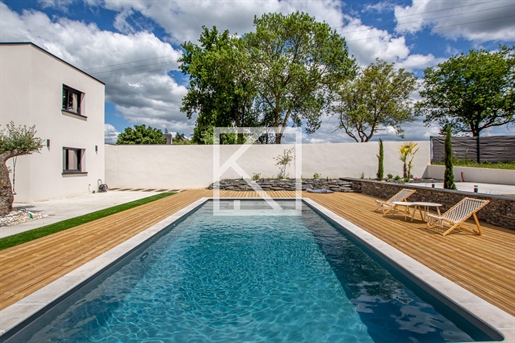 High-End contemporary, volumes and exceptional services, enjoying an unobstructed view at the gates