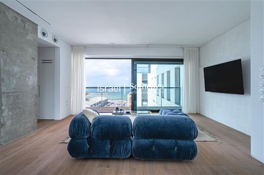 Design appartement met zeezicht naast het strand