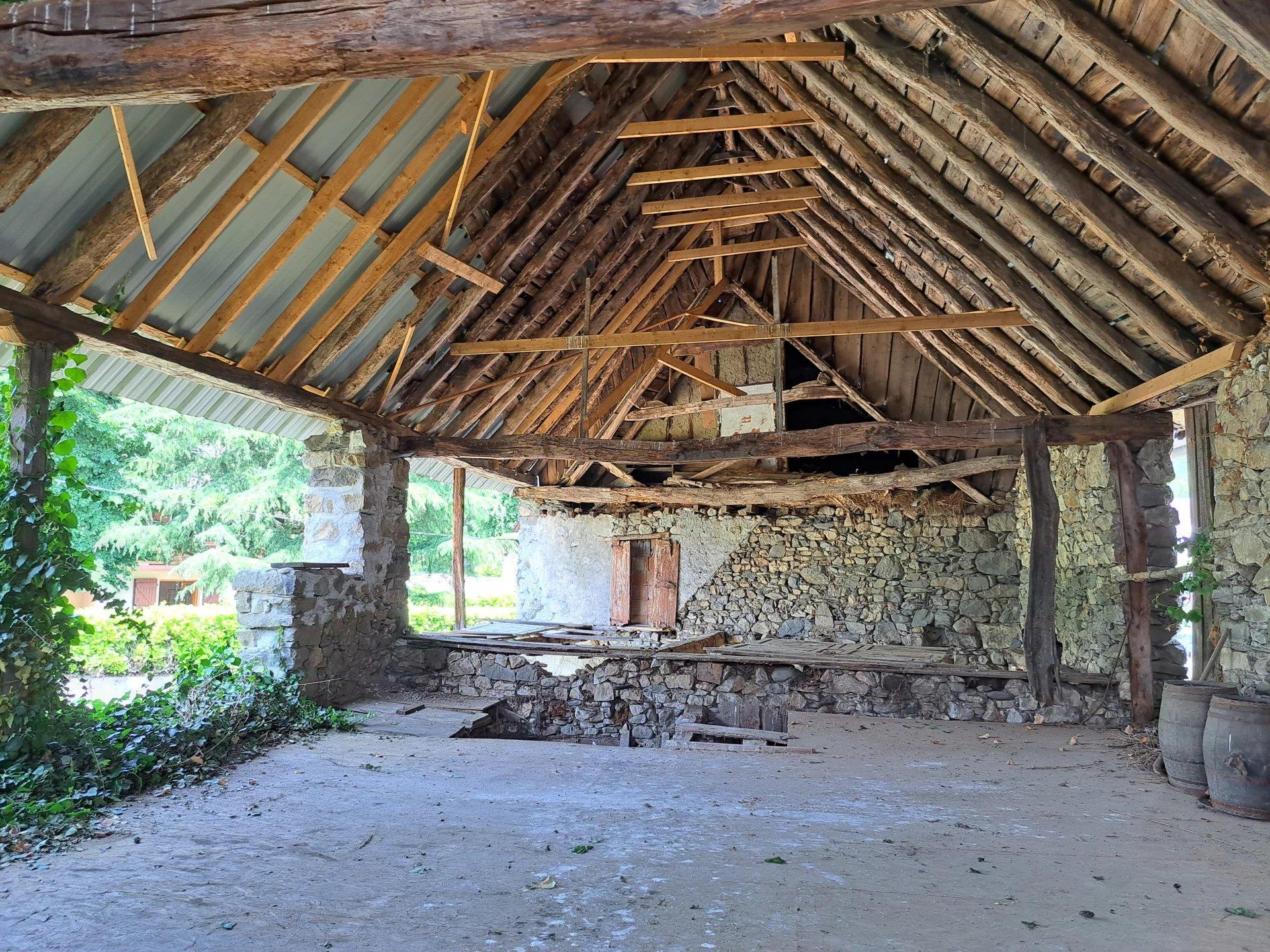 Stone house to renovate with 2 barns.