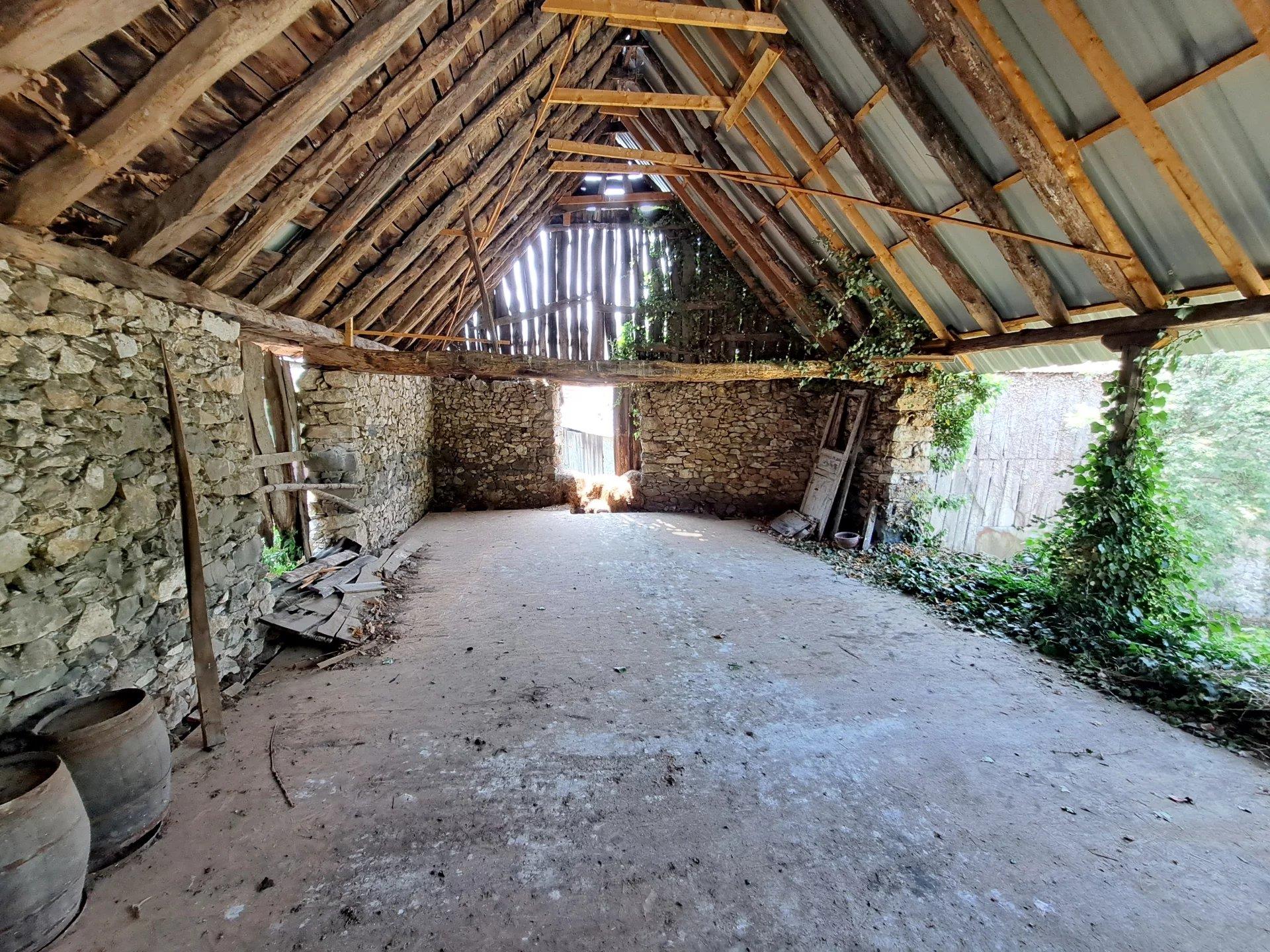 Stone house to renovate with 2 barns.