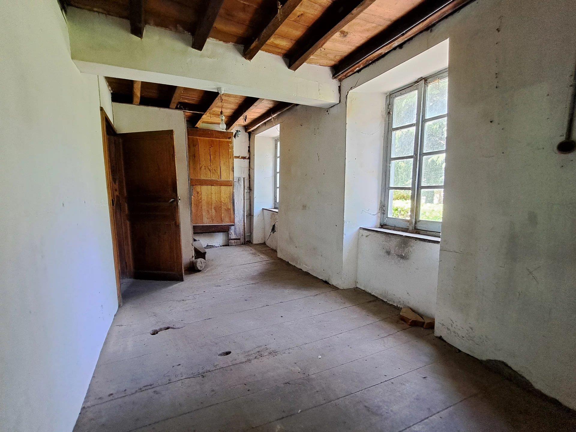 Stone house to renovate with 2 barns.