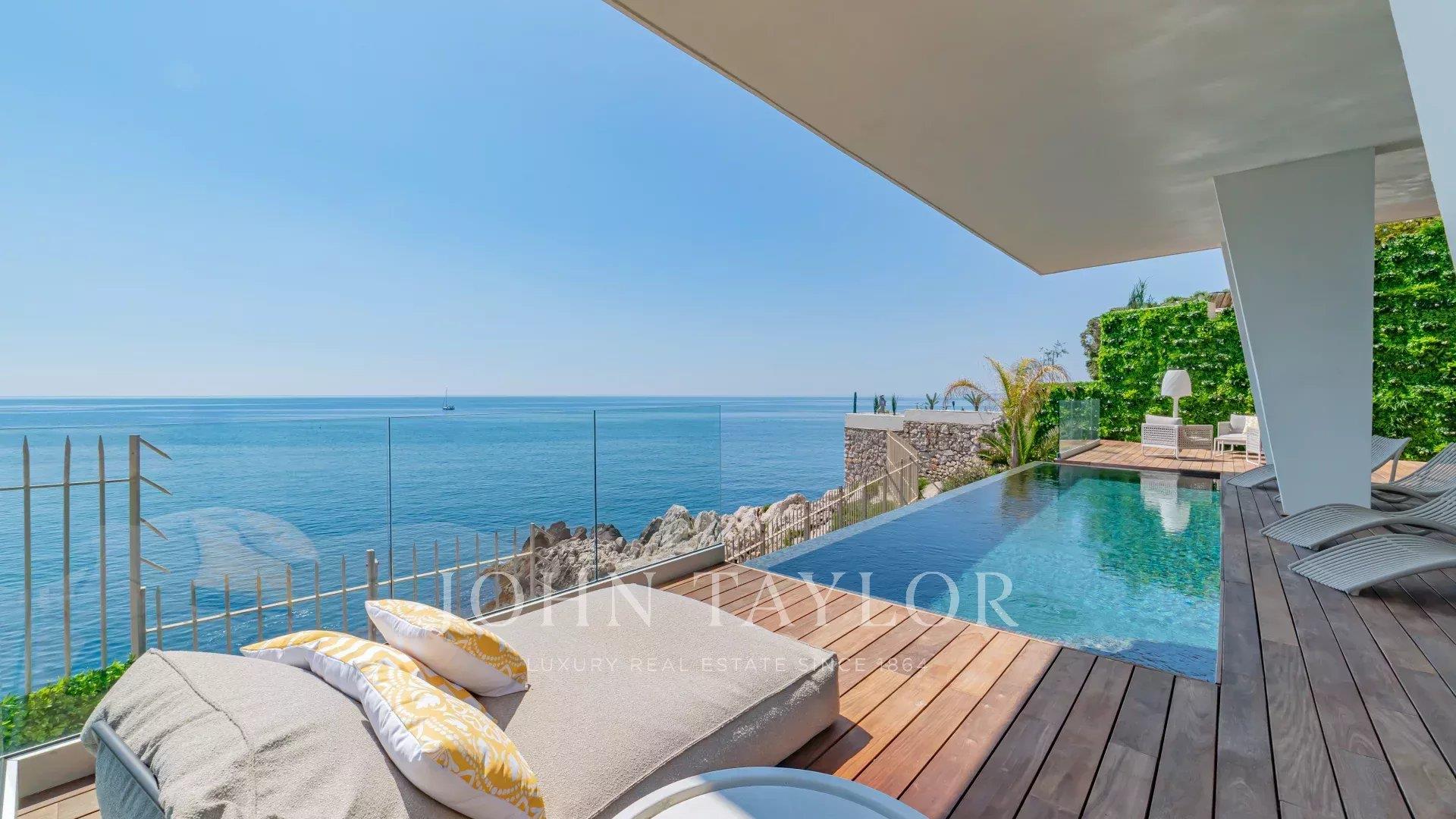 Contemporary Waterfront Villa with Panoramic Sea View
