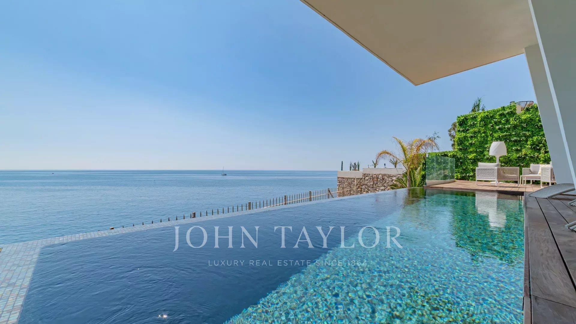 Contemporary Waterfront Villa with Panoramic Sea View
