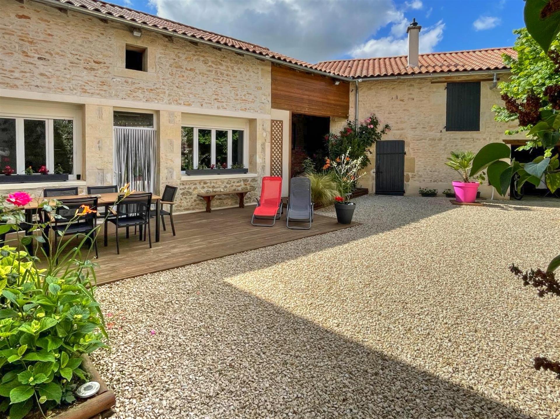 Well maintained village house with courtyard.