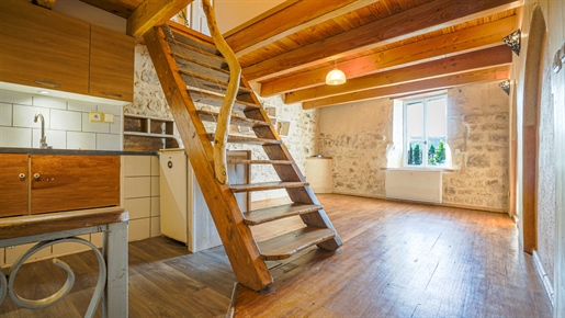 Charming village house with garden divided into two independent apartments.