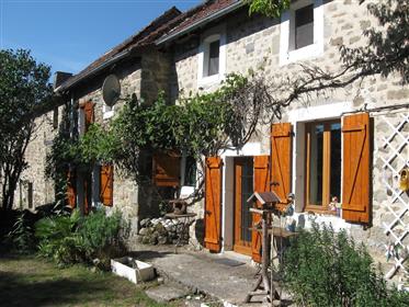 Limousin region, near Lupersat, a beautiful authentic stone house with a barn and a