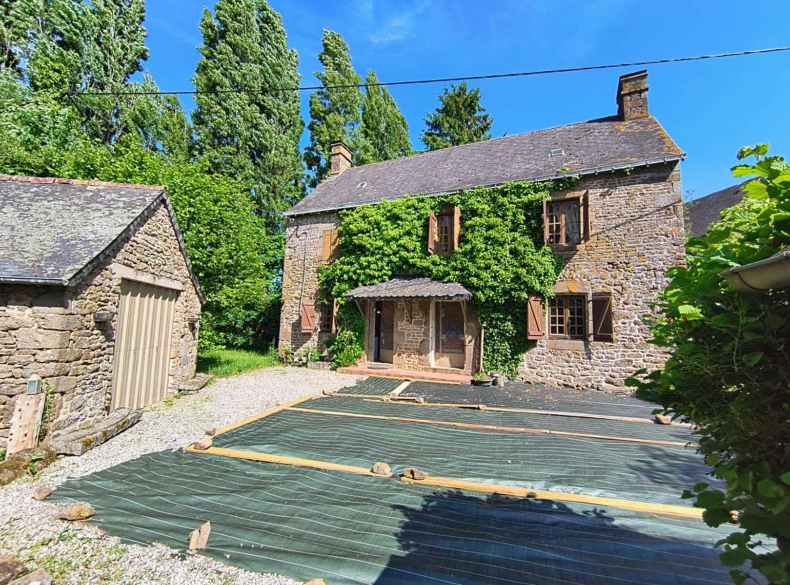 Detached character house with land and outbuildings in the countryside