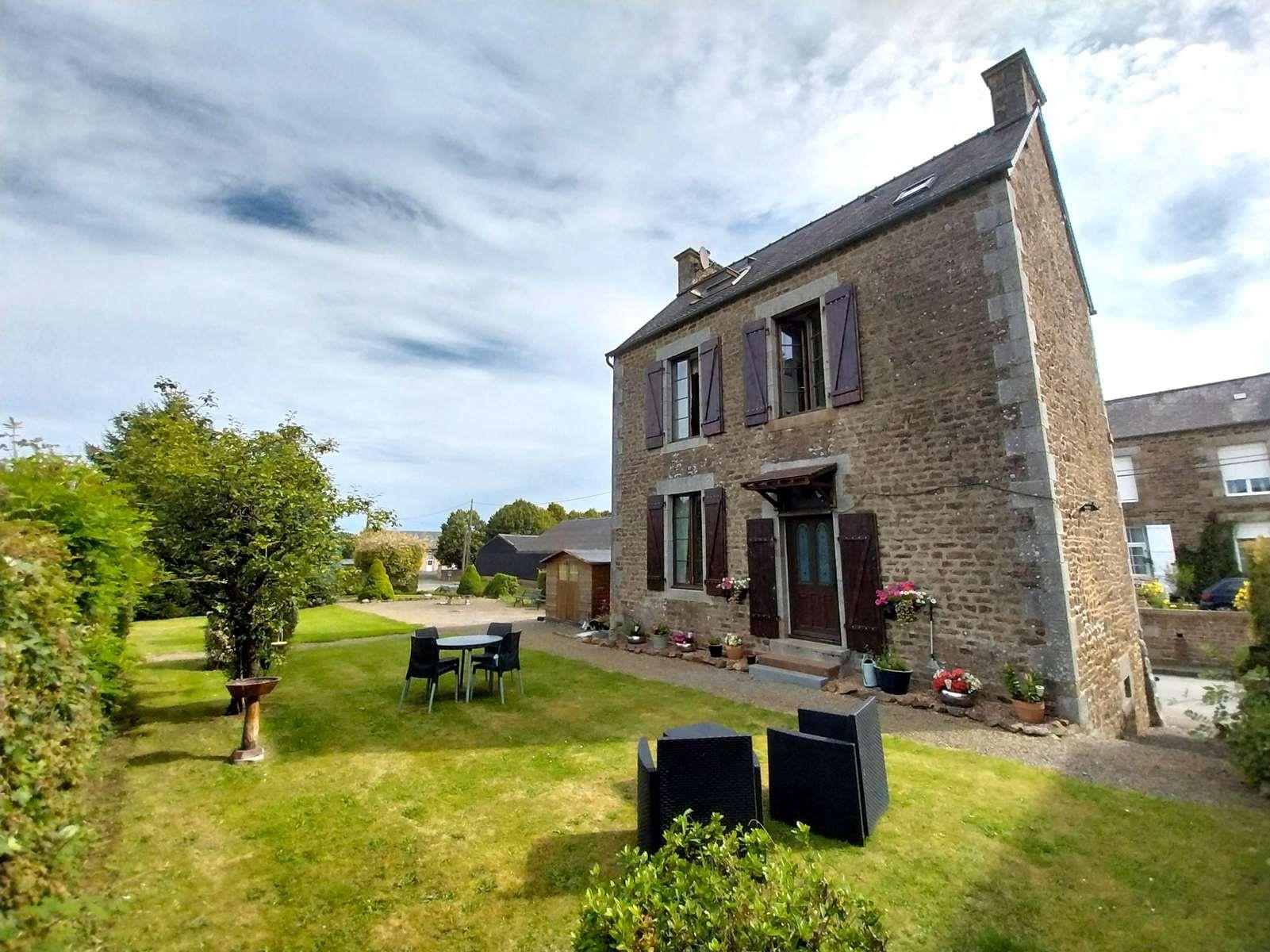 Detached stone house in a popular village