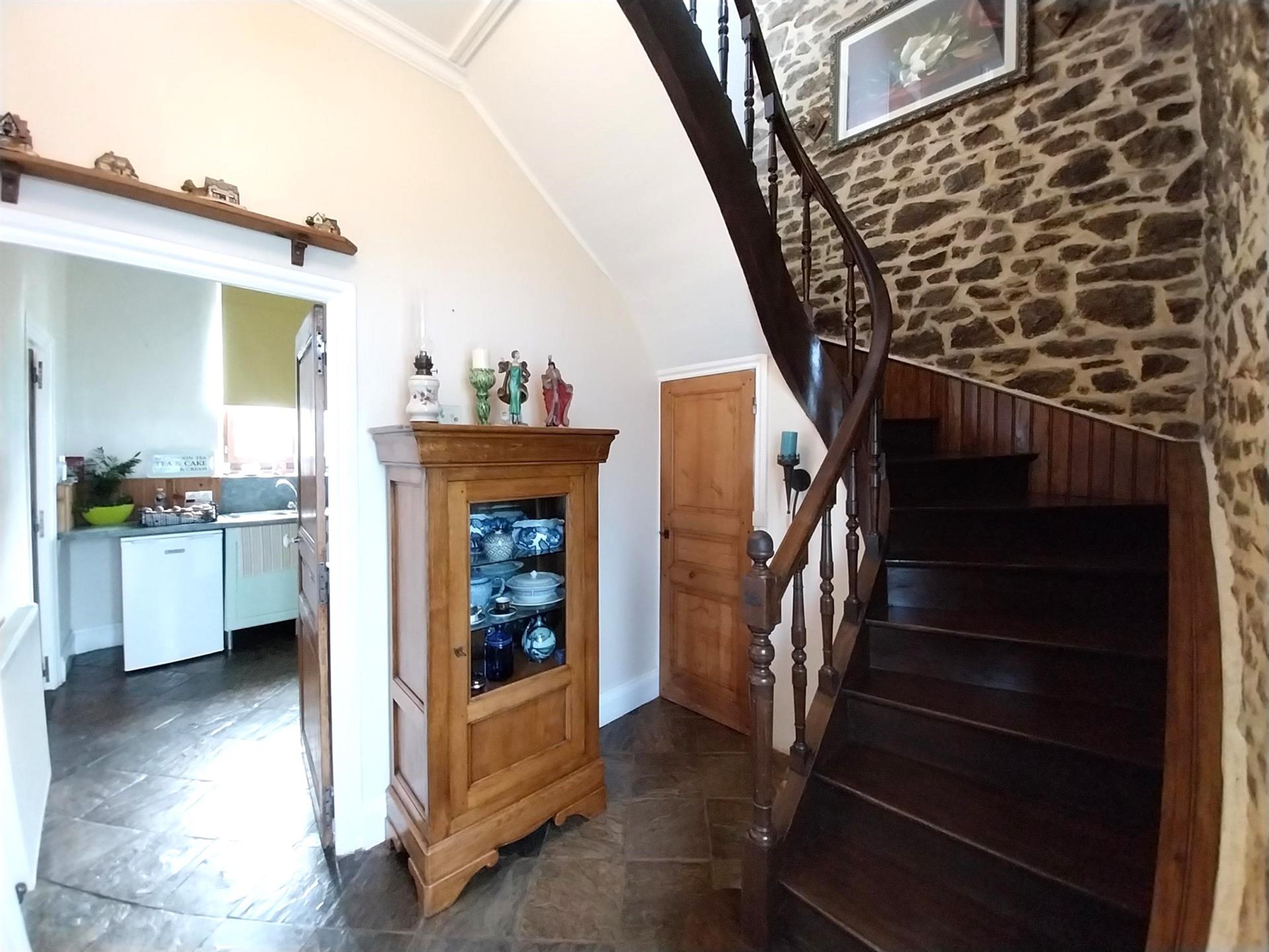Detached stone house in a popular village
