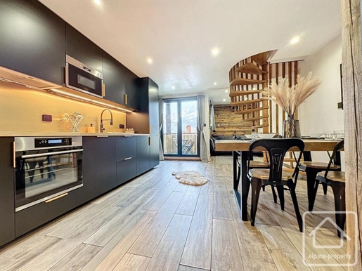 Contemporary renovated two bedroom duplex apartment with private parking and use of outside swimming