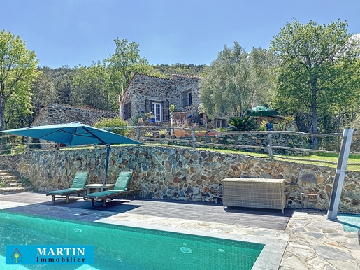 Stone farmhouse with swimming pool and outbuilding