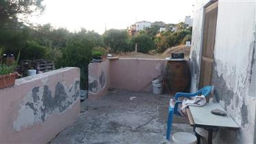 Building plot with a small house and sea view in Trypitos – Sitia. 