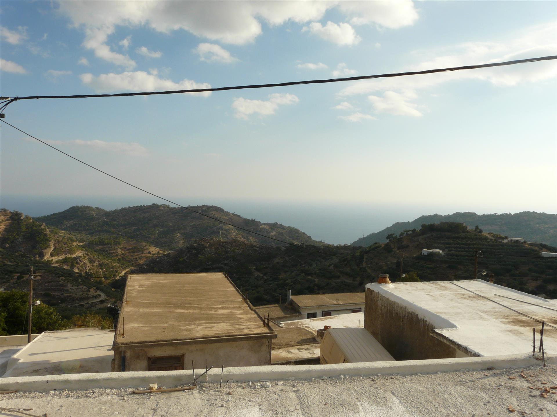 Gerenoveerd huis met een spectaculair uitzicht op de zee in Schinokapsala-Makrigialos.