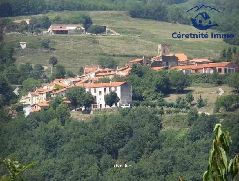 Casa de aldeia com garagem e terreno