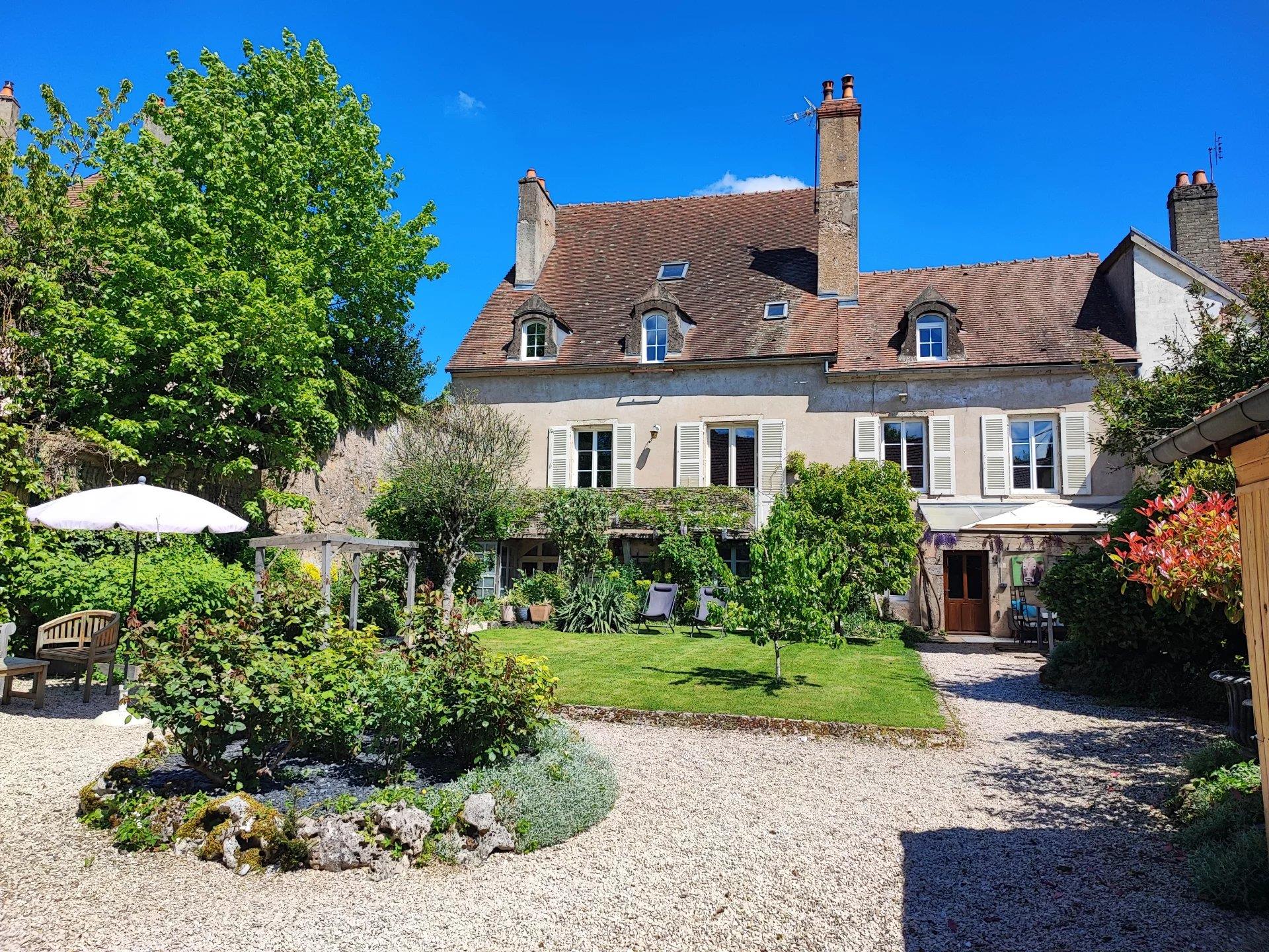 Authentic townhouse with garden and gites.