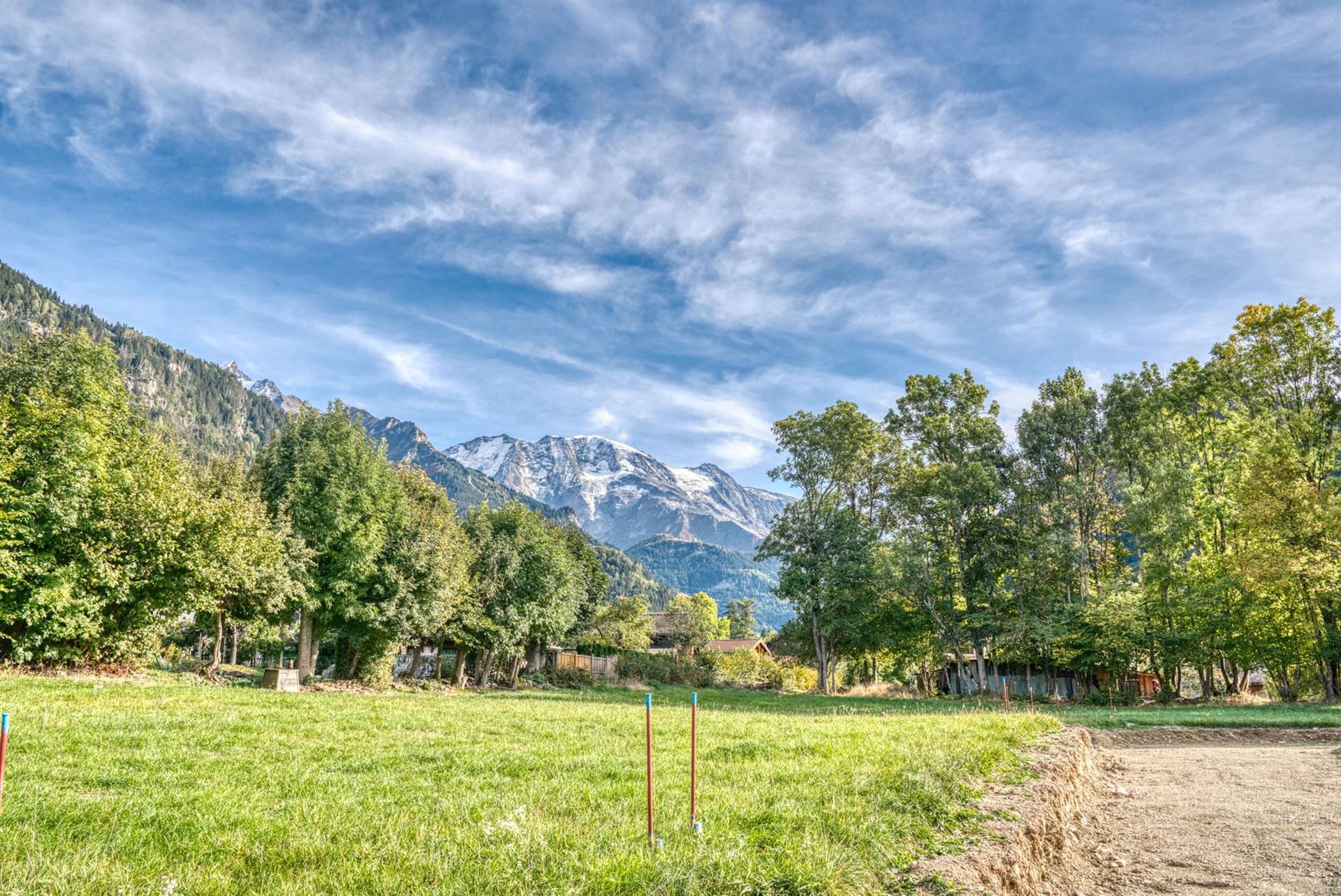 Land at the foot of the village