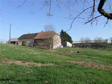 Agricultural property with house and outbuildings on 64 hectares of adjoining land with springs and