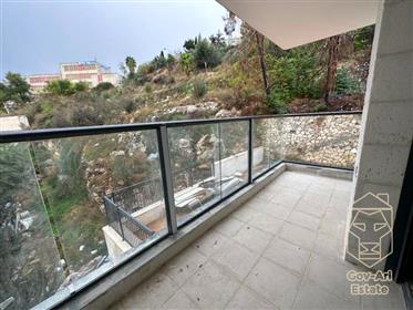 In the Ir Ganim neighborhood in a beautiful renovated stone building, a new apartment is offered for
