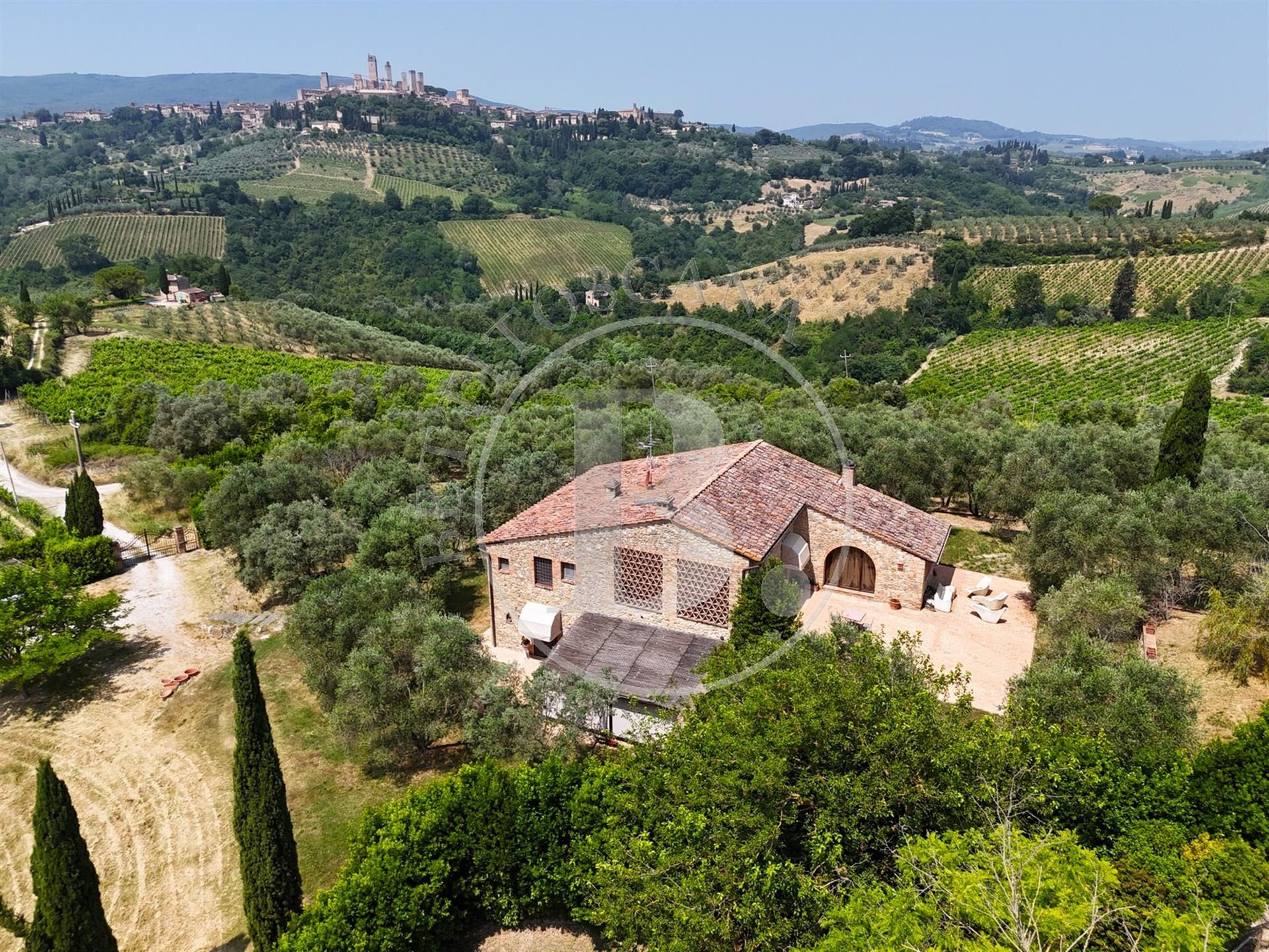 Beautifully renovated stone country house with a view of the towers of San Gimignano. 