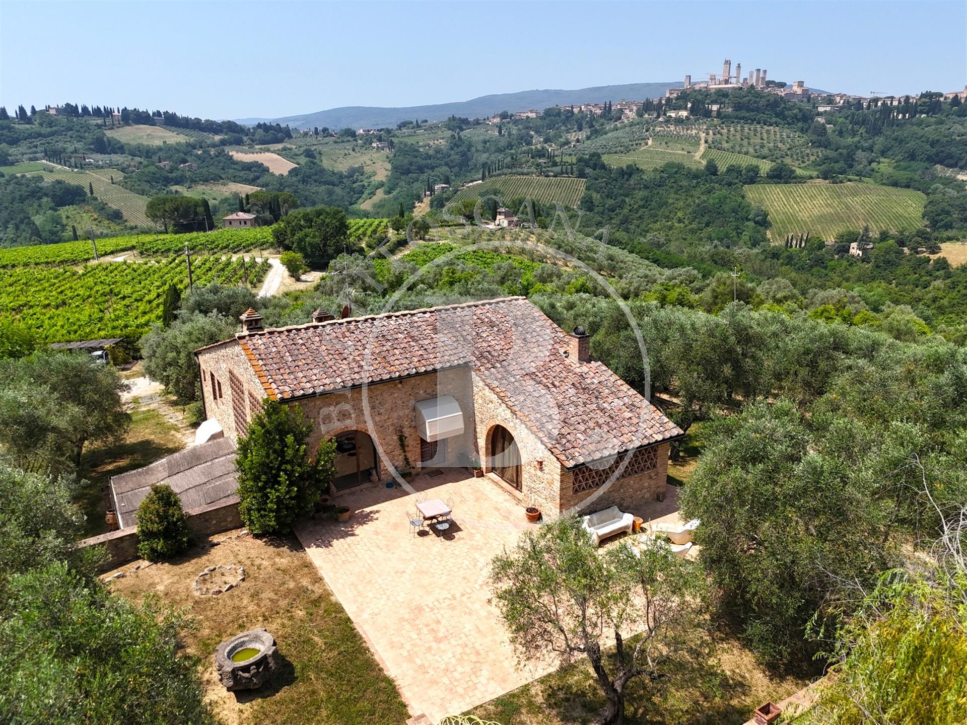 Beautifully renovated stone country house with a view of the towers of San Gimignano. 