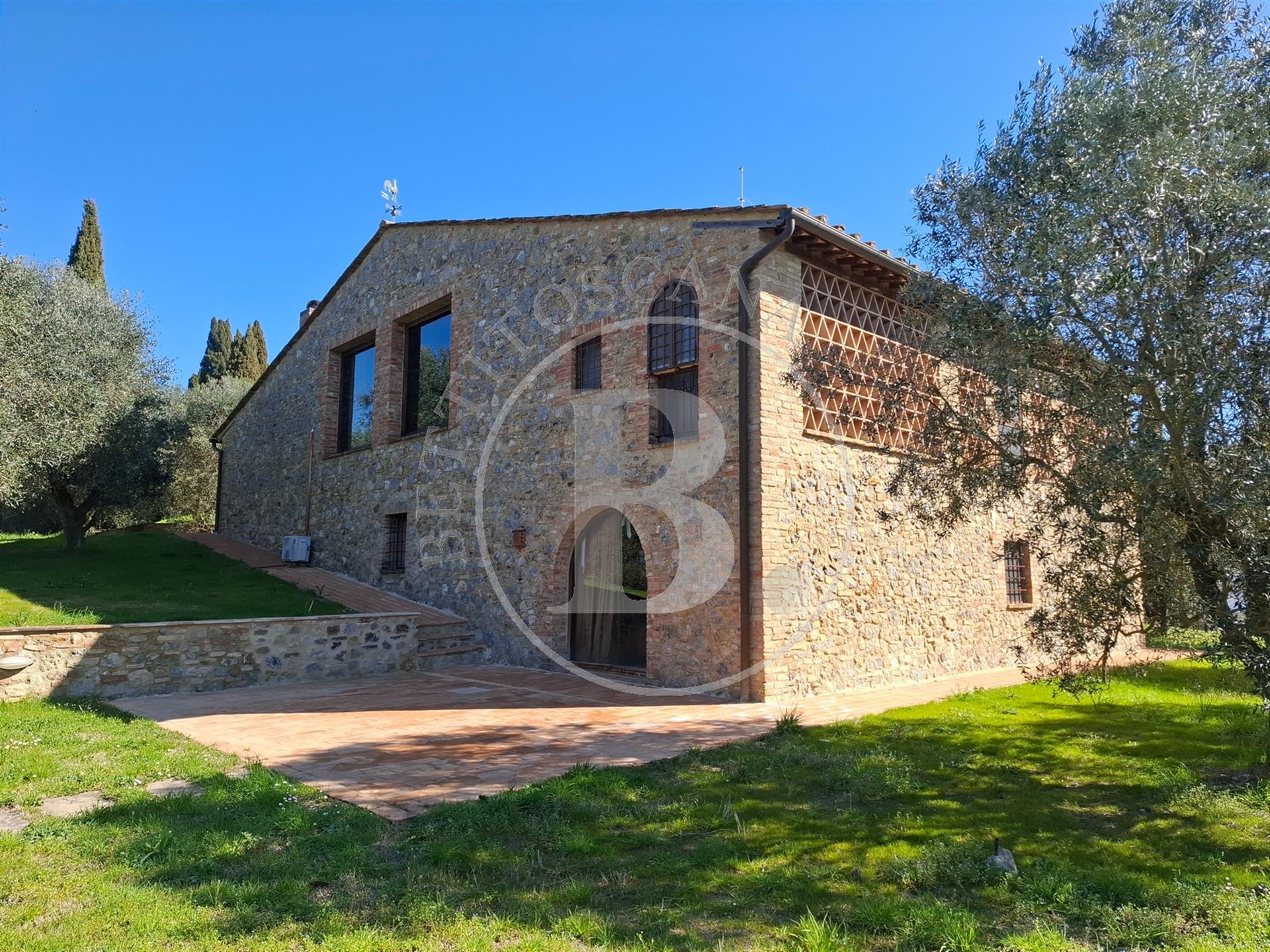 Beautifully renovated stone country house with a view of the towers of San Gimignano. 