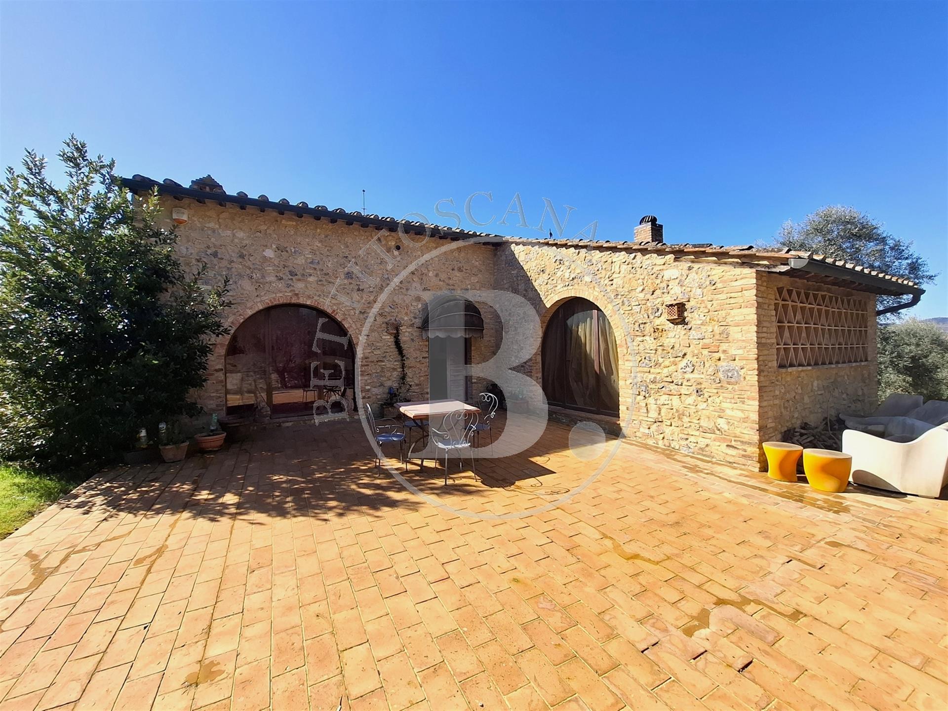 Beautifully renovated stone country house with a view of the towers of San Gimignano. 