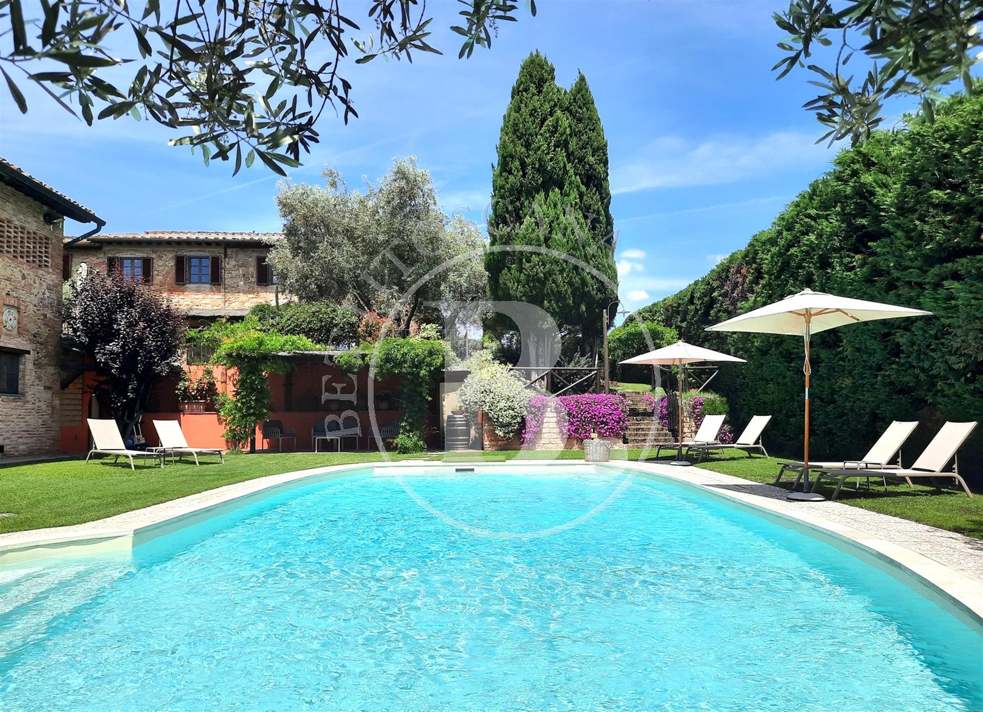 Xvii Century farmhouse with a restored barn set in a Tuscan countryside setting with the convenience