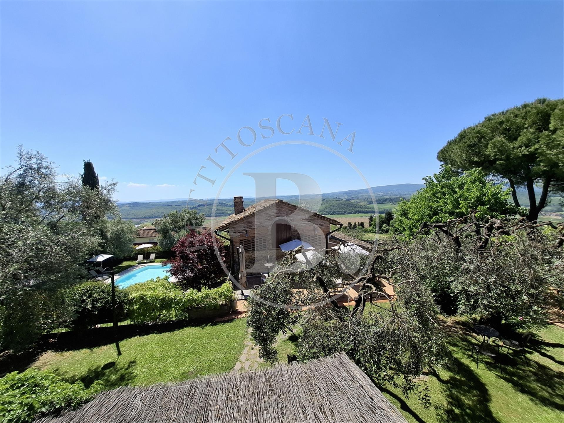 Xvii Century farmhouse with a restored barn set in a Tuscan countryside setting with the convenience