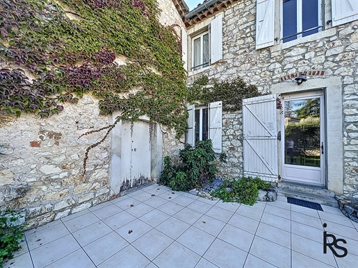 Environs of Les Vans : A property with 2921m2 land consisting of a stone house including a main dwel