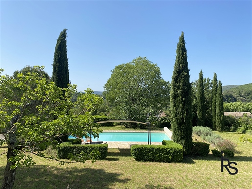 An exceptional charming house of 173 m2 with outbuilding of 57 m2, swimming pool and 1.22 ha of land