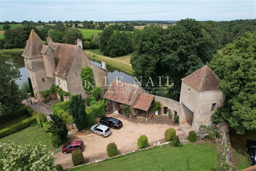 Pretty 14th And 15th Centuries Chateau In The Northern Auvergne French Region With Its Agricultural