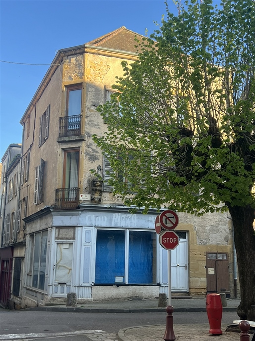 Charolles city center building with commercial premises and a duplex apartment