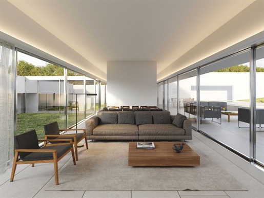 Villa avec 4 chambres, jardin, piscine et garage, conçue par Gonçalo Byrne, à Bom Sucesso Resort