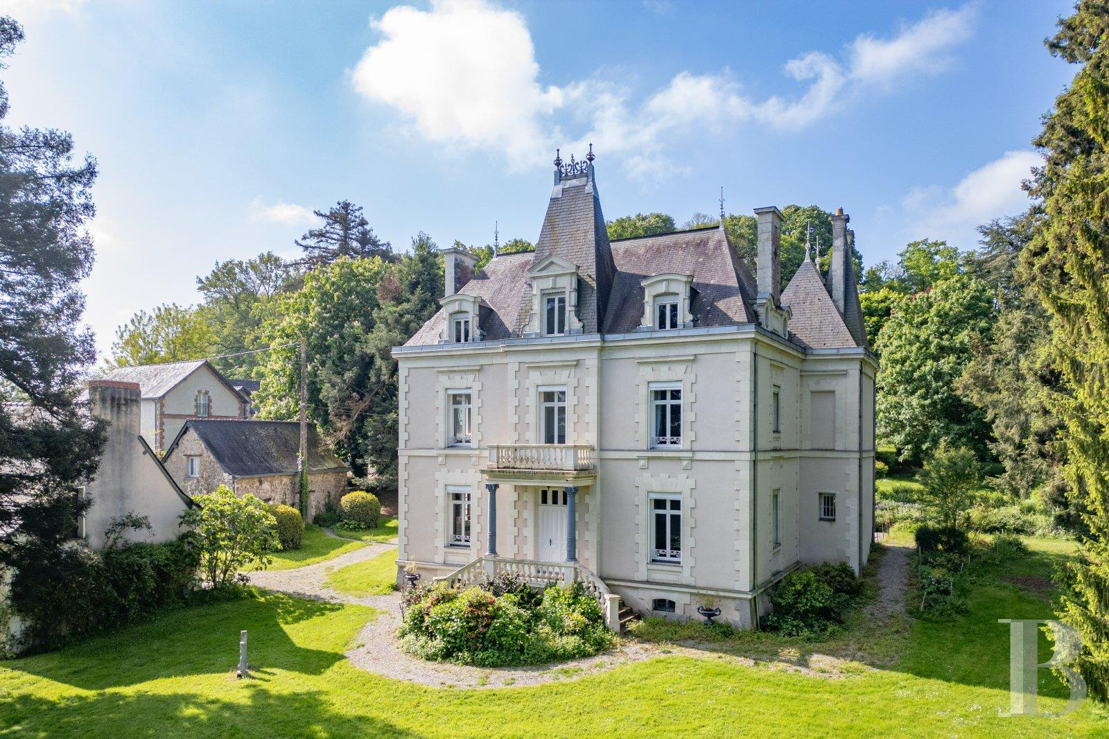 A 19th-century chateau and its many outbuildings on wooded grounds of 10 hectares, set within the na