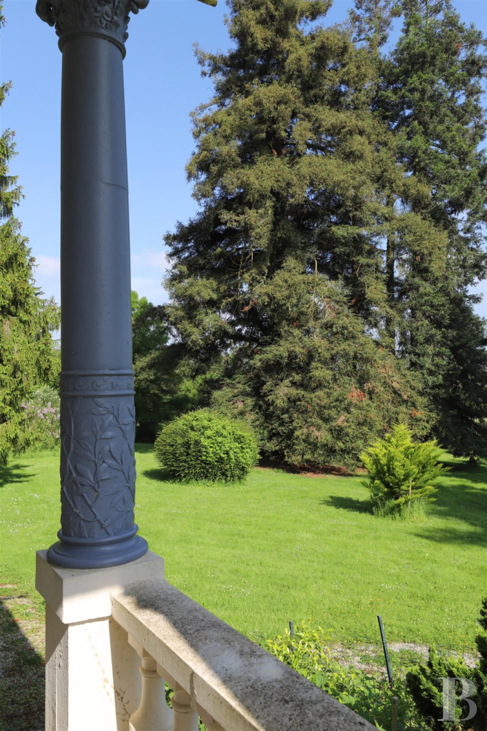 A 19th-century chateau and its many outbuildings on wooded grounds of 10 hectares, set within the na