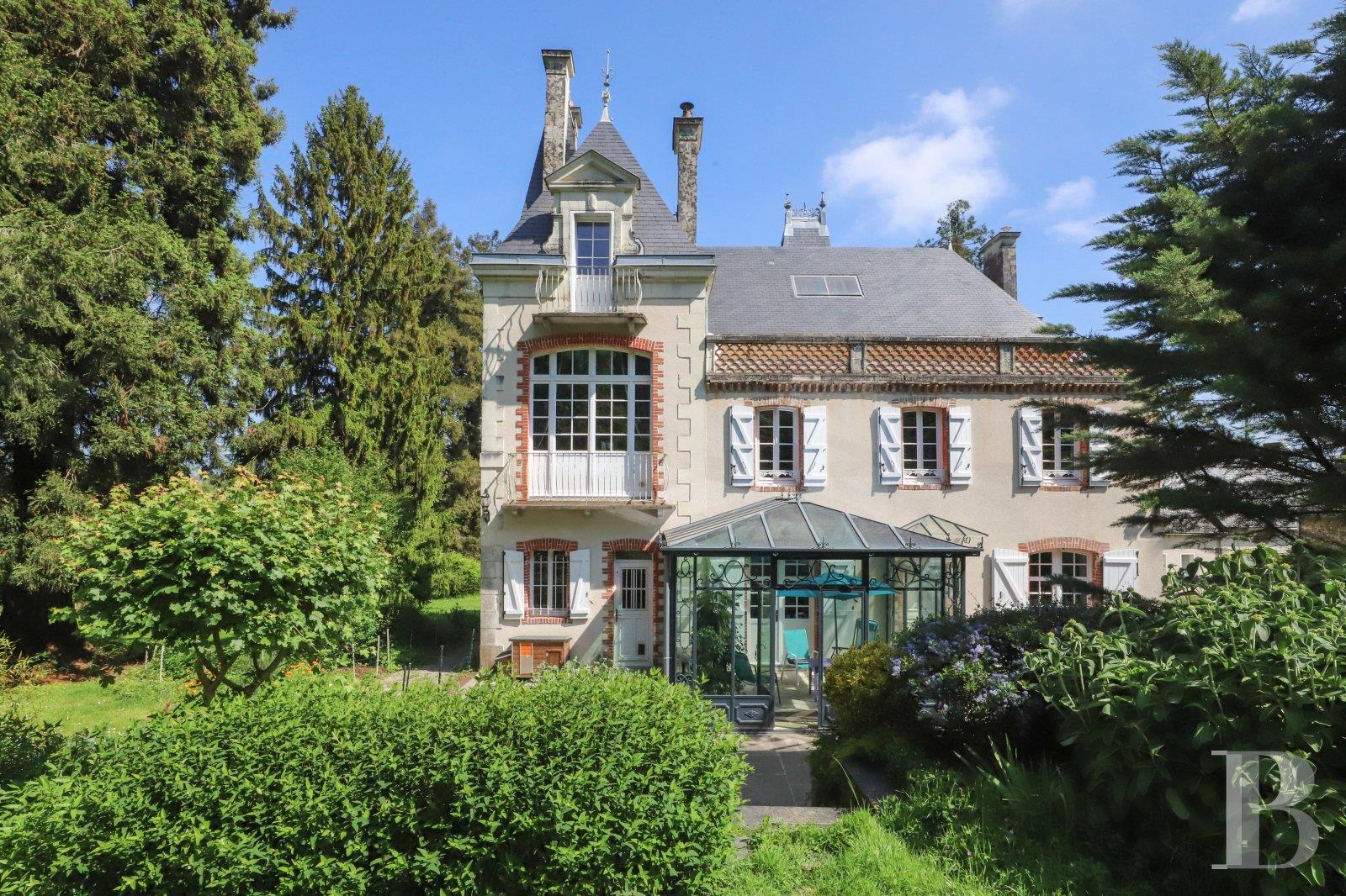 A 19th-century chateau and its many outbuildings on wooded grounds of 10 hectares, set within the na