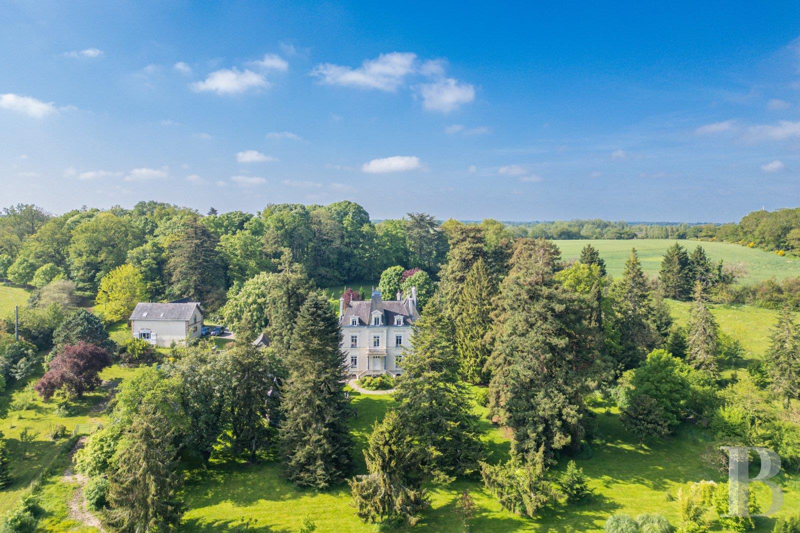 A 19th-century chateau and its many outbuildings on wooded grounds of 10 hectares, set within the na