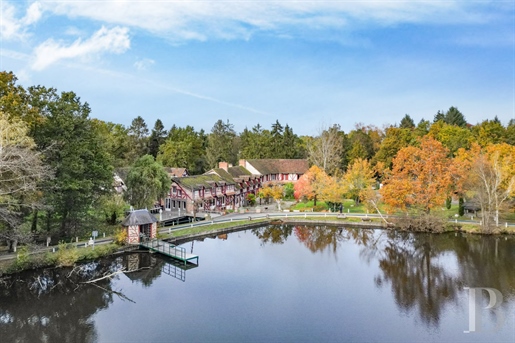 An old watermill converted into a hotel with outhouses and a swimming pool in over eight hectares of