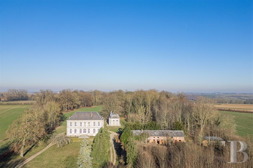 A neoclassical chateau with an 18th-century chapel in 23 hectares of grounds near the city of Amiens