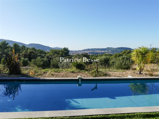 A contemporary farmhouse on 8000 m² of terraced grounds in a natural area with a view stretching all