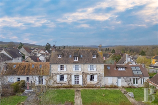 An 18th century priory and outbuildings set in 3 200 m² of grounds in the heart of a village, 80 km