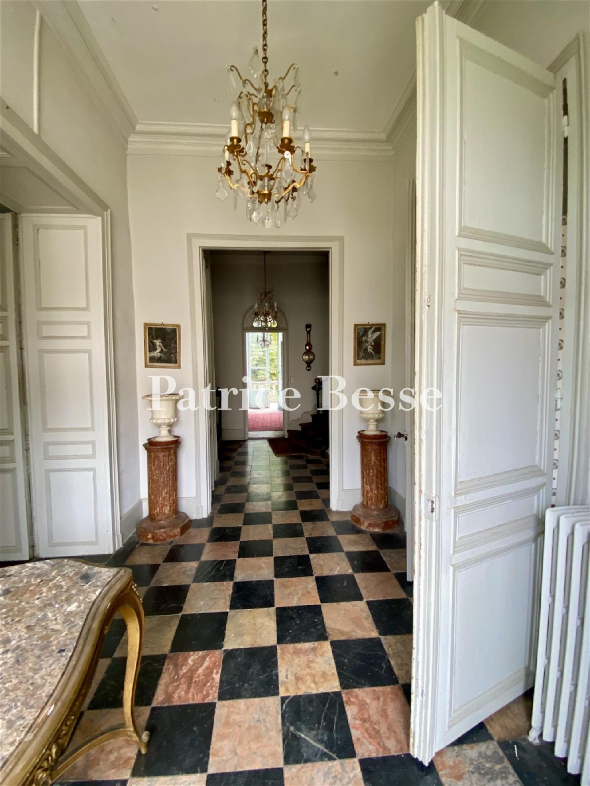 In a town in the Haut-Anjou region, a 19th century mansion with outbuildings surrounded by its walle