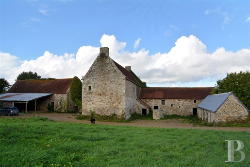 A sixteenth-century country house with outbuildings, to be restored in grounds covering one and a ha