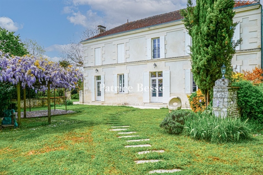 A 19th century residence, its former winery and swimming pool, set in almost 9,000 m² of wooded grou