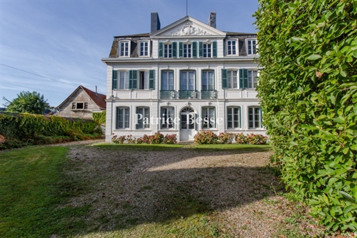 A 19th-century house with a walled garden that covers over 2,600m² in a vibrant village in France's