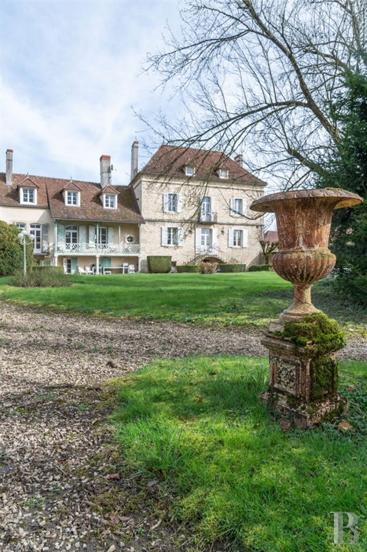 A grand 18th-century house with tree-dotted grounds, nestled in a village in Burgundy, two hours fro