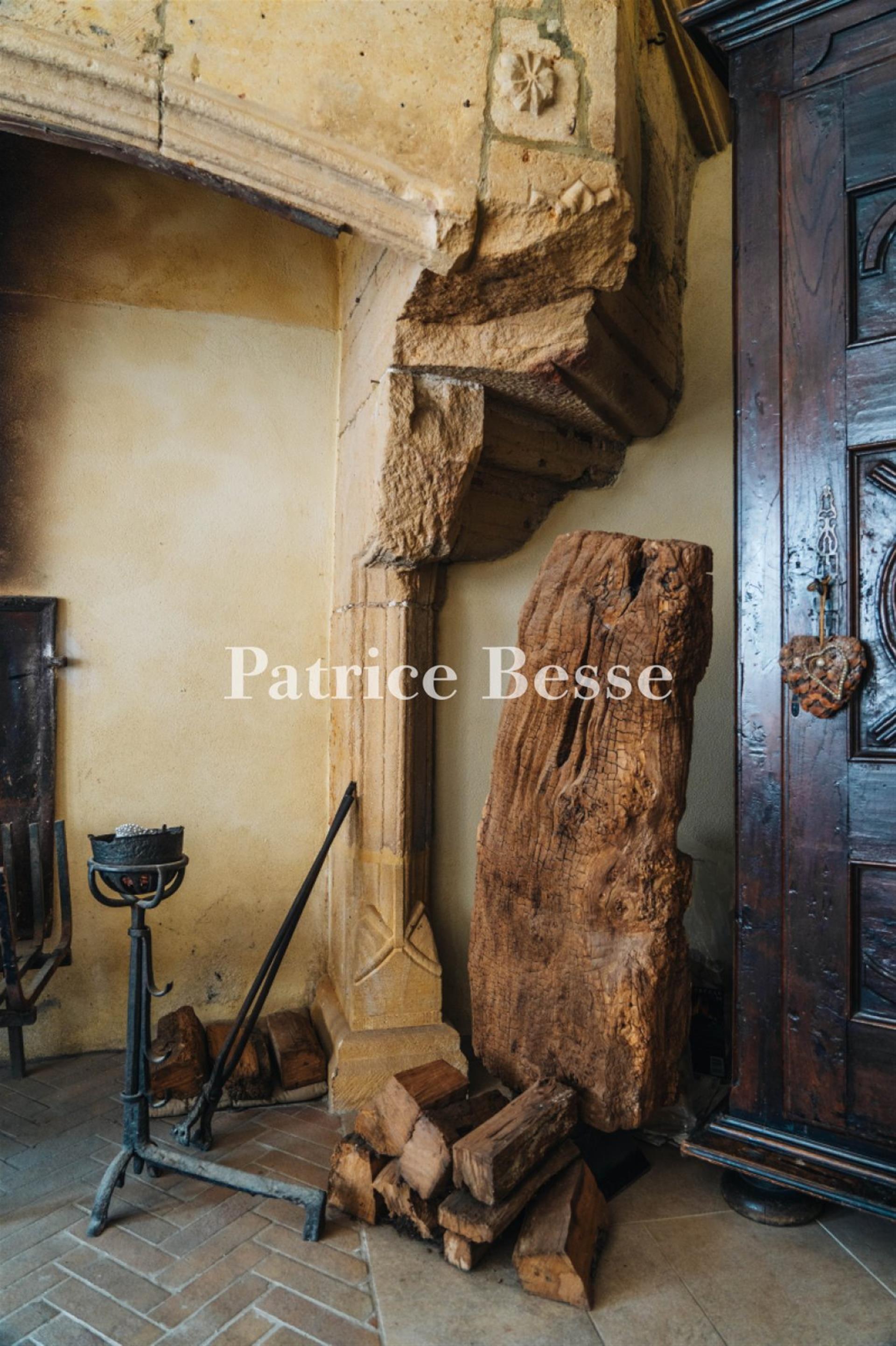 A renovated 14th-century dwelling with an interior courtyard and medieval tower, in the middle of a