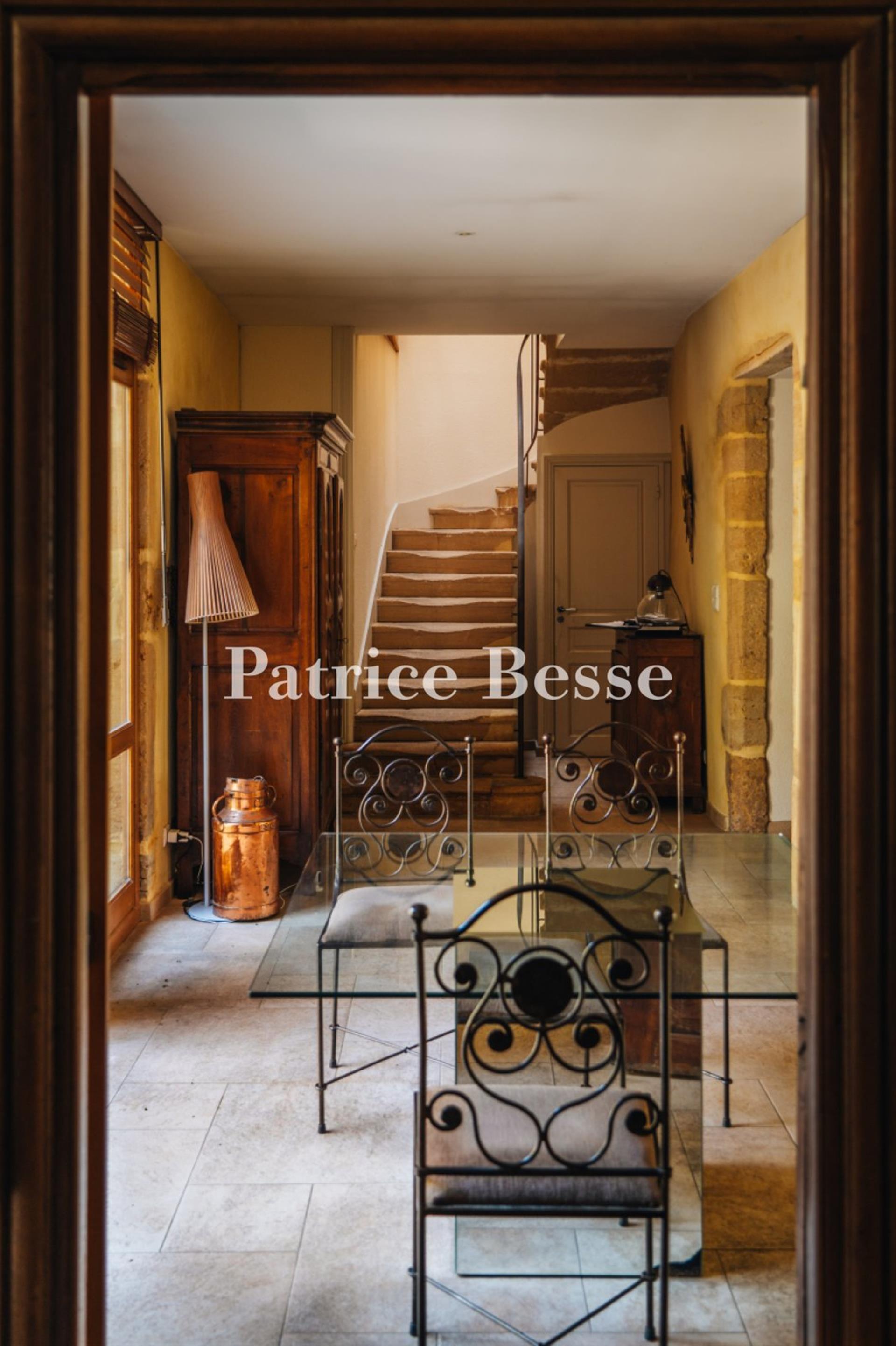 A renovated 14th-century dwelling with an interior courtyard and medieval tower, in the middle of a