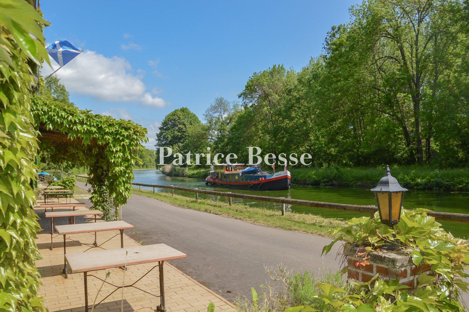 A waterside house and Scottish-style inn, facing a canal, tucked away in the valley of the River Loi