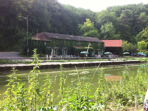 A waterside house and Scottish-style inn, facing a canal, tucked away in the valley of the River Loi